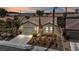 Charming single-story home featuring a manicured yard, palm trees, and a two-car garage at 2119 Lewiston Pl, Henderson, NV 89044