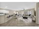 Bright living room with tile floors, neutral walls, and stylish furniture arrangement at 2119 Lewiston Pl, Henderson, NV 89044
