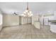 Spacious living area with open layout, modern lighting, and tile flooring at 2119 Lewiston Pl, Henderson, NV 89044