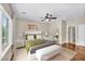 Serene bedroom with hardwood floors, a ceiling fan, and a bright window at 2119 Lewiston Pl, Henderson, NV 89044