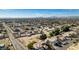 Sweeping aerial view of lot with surrounding neighborhood homes in a mature community, near the city skyline at 2294 N Pecos Rd, Las Vegas, NV 89115