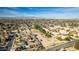 Scenic aerial view of property surrounded by houses in well-established neighborhood with views of mountains at 2294 N Pecos Rd, Las Vegas, NV 89115