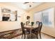 Dining area features wooden table with four chairs and an accent rug at 2816 Ground Robin Dr, North Las Vegas, NV 89084