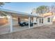 A covered patio offers an outdoor seating area and view of the yard at 2823 Landau Ct, Henderson, NV 89074