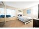 Bedroom with neutral decor featuring a double bed, bright window, and soft carpet at 2823 Landau Ct, Henderson, NV 89074