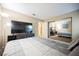 Bedroom featuring large bed, television on dresser, closet, and neutral-toned walls at 2823 Landau Ct, Henderson, NV 89074