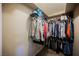 A closet is well-organized with clothing, accessories, and shelves for optimal storage at 2823 Landau Ct, Henderson, NV 89074