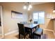 Charming dining area with a modern table and seating, complemented by neutral walls and bright natural light at 2823 Landau Ct, Henderson, NV 89074