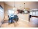 Cozy dining area adjacent to the kitchen, featuring tile floors and stylish lighting fixtures at 2823 Landau Ct, Henderson, NV 89074