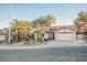 Well-maintained single-story home with desert landscaping and a two-car attached garage at 2823 Landau Ct, Henderson, NV 89074