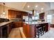 Well-equipped kitchen with a large island, stainless steel appliances, and ample cabinet space for storage at 2823 Landau Ct, Henderson, NV 89074