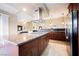 Kitchen with an open layout to the living area with a large granite island and stainless steel appliances at 2823 Landau Ct, Henderson, NV 89074