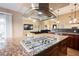 Gourmet kitchen features granite counters, stainless steel appliances, and a modern overhead vent at 2823 Landau Ct, Henderson, NV 89074