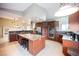 Updated kitchen with granite counters, center island, and stainless-steel appliances at 2823 Landau Ct, Henderson, NV 89074