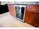 This kitchen includes wine storage, custom wood cabinets, and modern stainless steel hardware at 2823 Landau Ct, Henderson, NV 89074