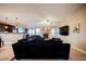 Comfortable living area with brick fireplace and open view into the renovated kitchen at 2823 Landau Ct, Henderson, NV 89074