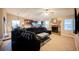 Inviting living room features tile flooring and a brick fireplace at 2823 Landau Ct, Henderson, NV 89074
