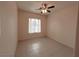 This is a bedroom with tile flooring, a ceiling fan and a single window at 3004 Darby Falls Dr, Las Vegas, NV 89134