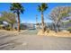 Well-maintained tennis court bordered by palm trees, offering a recreational amenity at 3119 Desmond Ave, Las Vegas, NV 89121