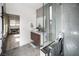 This bathroom features a modern vanity, sleek walk-in shower, and stylish gray tiling, creating a spa-like retreat at 3530 S Spring Mountain Blvd Ct, Pahrump, NV 89048
