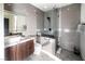 This bathroom features a modern vanity, sleek walk-in shower, and stylish gray tiling, creating a spa-like retreat at 3530 S Spring Mountain Blvd Ct, Pahrump, NV 89048