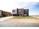Contemporary home with a combination of textures and a unique water feature at 3530 S Spring Mountain Blvd Ct, Pahrump, NV 89048