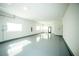 Bright and spacious garage area with epoxy flooring and ample natural light at 3530 S Spring Mountain Blvd Ct, Pahrump, NV 89048