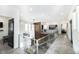 Open hallway overlooking the living room and featuring a glass railing and views of two bedrooms at 3530 S Spring Mountain Blvd Ct, Pahrump, NV 89048