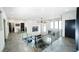 Hallway with glass railings, views to living area, and modern fixtures at 3530 S Spring Mountain Blvd Ct, Pahrump, NV 89048