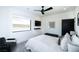 Bright bedroom featuring a ceiling fan, a modern light fixture and a large window with desert views at 3530 S Spring Mountain Blvd Ct, Pahrump, NV 89048