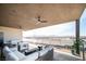This covered patio offers views and features ample seating and a modern fire pit, perfect for relaxing or entertaining outdoors at 3530 S Spring Mountain Blvd Ct, Pahrump, NV 89048
