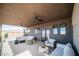 This covered patio offers mountain views, ceiling fans, and plenty of comfortable seating, making it ideal for outdoor living at 3530 S Spring Mountain Blvd Ct, Pahrump, NV 89048