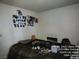 A spacious bedroom is decorated with personal touches and a comfortable bed at 421 Miller Ave, North Las Vegas, NV 89030