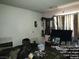 A cozy bedroom features soft light, a comfortable bed, and a place to relax at 421 Miller Ave, North Las Vegas, NV 89030