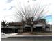 Modest single-story home featuring awnings and mature landscaping in a desert environment at 421 Miller Ave, North Las Vegas, NV 89030