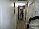 Hallway view with multiple doors and a mirror in the bottom right corner at 421 Miller Ave, North Las Vegas, NV 89030