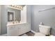 Bathroom featuring a white vanity, bright mirror, and tiled floors at 4450 Zev Ct, Las Vegas, NV 89121