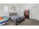 Comfortable bedroom showcasing neutral walls, a large window, and a plush carpet at 4450 Zev Ct, Las Vegas, NV 89121