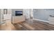 Neutral bedroom with hardwood floors, a dresser and an ensuite bath at 4450 Zev Ct, Las Vegas, NV 89121