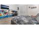 Bedroom with a neutral palette, and ample display shelving providing plenty of storage at 4450 Zev Ct, Las Vegas, NV 89121