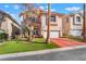 Charming two-story home featuring a well-maintained lawn and a red driveway at 4450 Zev Ct, Las Vegas, NV 89121