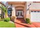 Close-up of front entrance featuring a double door and manicured landscaping at 4450 Zev Ct, Las Vegas, NV 89121