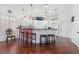 Bright kitchen featuring a breakfast bar with seating and white cabinetry at 4450 Zev Ct, Las Vegas, NV 89121