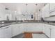 The kitchen boasts a counter with a sink and white cabinets at 4450 Zev Ct, Las Vegas, NV 89121