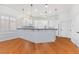 Eat-in kitchen with breakfast bar featuring stainless steel appliances and pendant lighting at 4450 Zev Ct, Las Vegas, NV 89121