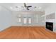 Living area featuring natural light, hardwood floors, a fireplace, and backyard access at 4450 Zev Ct, Las Vegas, NV 89121