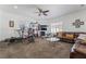 Spacious living room featuring plush leather sofa and workout equipment at 4450 Zev Ct, Las Vegas, NV 89121