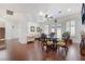 Open-concept living area with hardwood floors, neutral tones, and a view of the staircase at 4450 Zev Ct, Las Vegas, NV 89121