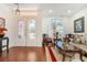 Bright living room featuring a decorative front door, large window, and elegant decor at 4450 Zev Ct, Las Vegas, NV 89121