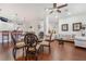 Spacious living room with hardwood floors, a kitchen bar, and comfortable seating at 4450 Zev Ct, Las Vegas, NV 89121